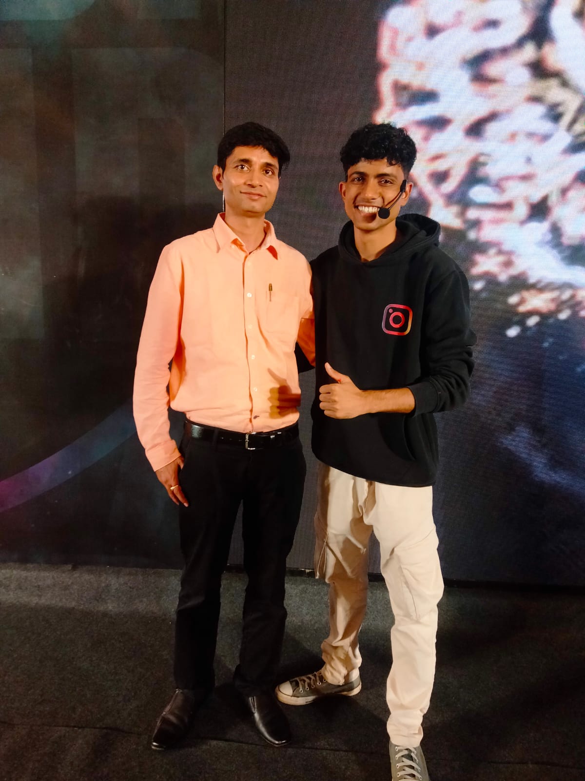 Avnish Pandey with a content creator at an industry event